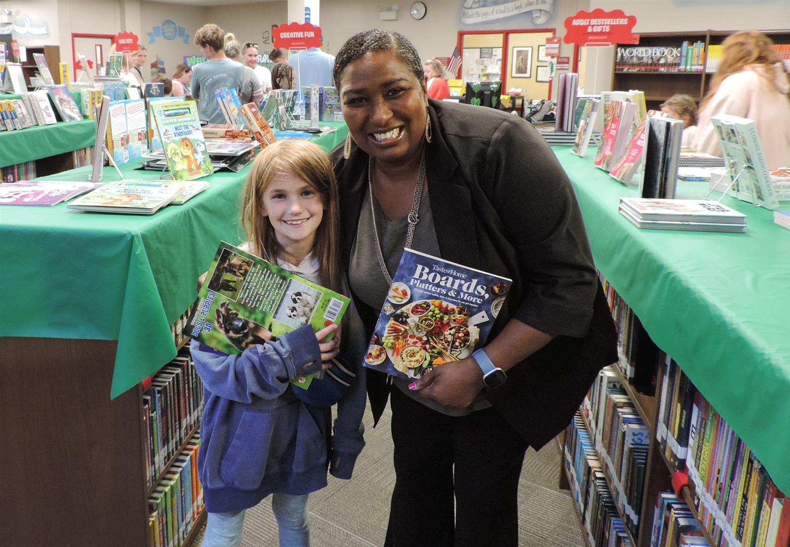 Principal and student at the Book Fair